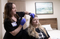 Registered polysomnographer Janine White, RPSGT, prepares a patient for an overnight sleep study, an important step toward diagnosing and treating sleep disorders, at the newly expanded Sleep Lab at St. Luke’s Miners Campus. PHOTO/SLUHN