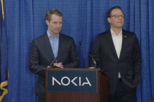 Nokia President and CEO Justin Hotard, left, and Pa. Gov. Josh Shapiro, right, announce that Nokia is investing $30M in its Allentown facility.