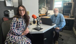 Volunteer music programmer, Bill Dautremont-Smith, hosts community member, Elizabeth Ortiz, on “My Three Songs,” a segment where guests share 3 songs that influenced their lives. PHOTO/WDIY